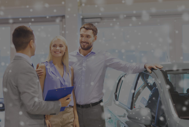 couple meeting with a car dealer